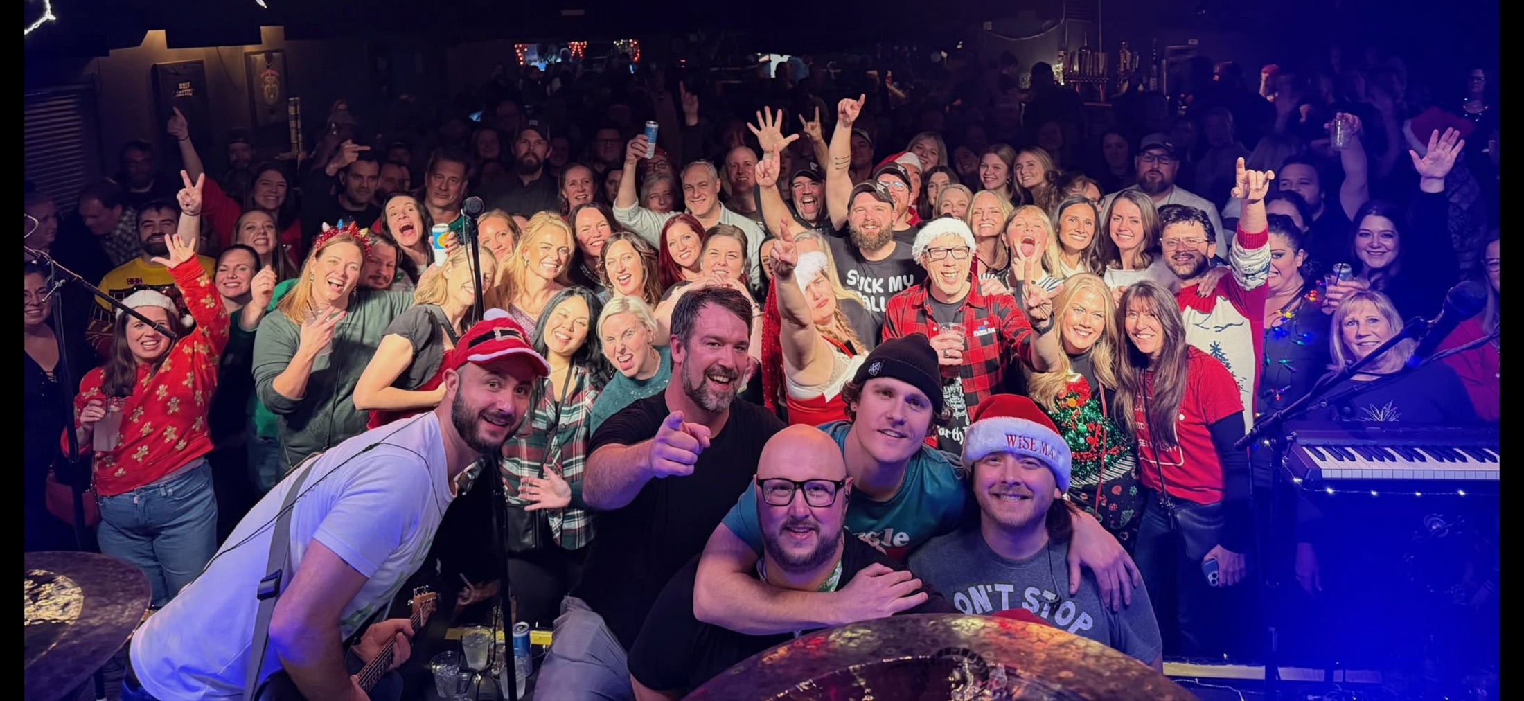 Your Dad’s Band with a packed crowd after a holiday show